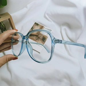 Detail of light blue transparent eyeglass frame with printed size specifications