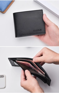 Detail of men's black tri-fold leather wallet showing internal card slots and bill pocket