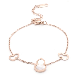 Rose gold stainless steel bracelet featuring mother of pearl shell gourd charms