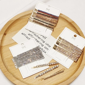 Minimalist rhinestone hair clip set with alloy and artificial crystals on a display card