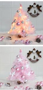 Detail of a 60cm pink mini Christmas tree with LED lights and festive ornaments