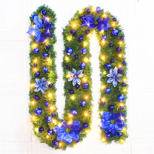 Detail of 2.7m Christmas garland with blue flowers, ornaments and warm LED lights
