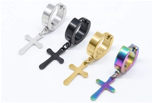 Detailed view of stainless steel hoop earrings with cross pendants in four metallic colors