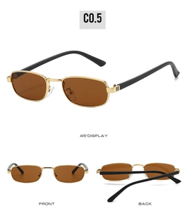 Detail view of vintage square sunglasses with gold metal frames and striped temple design