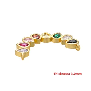 Detail of 3.0mm thickness rainbow connector with pear-cut cubic zirconia in gold setting