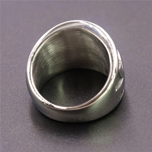 Macro view of polished inner band showing brushed stainless steel texture on the ring
