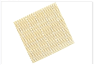 Detailed macro view of natural bamboo sushi rolling mat with fine cotton weaving