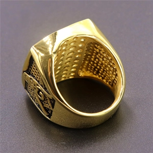 Golden Masonic Viking ring with black embossed patterns and honeycomb inner texture