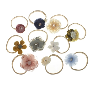 Set of 10 nylon baby headbands featuring colorful fabric and mesh flower details
