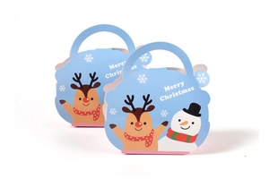 Detail of light blue Christmas gift bags with cartoon reindeer and snowman designs