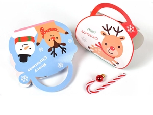 Close-up of festive Christmas gift bags with reindeer and snowman prints in blue and white