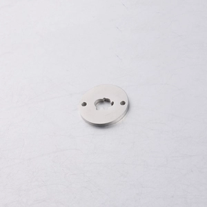 Detail of mirror polished stainless steel tag with elephant cutout and dual holes