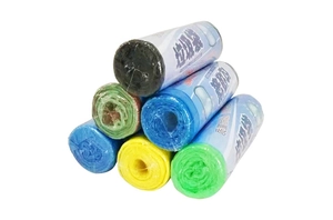 Detailed close-up of a multi-color drawstring trash bag roll set on a white background