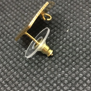 Golden flying saucer ear stud backing with transparent plastic gasket for DIY jewelry