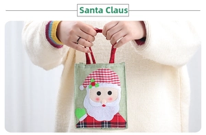 Detail von Weihnachts-Geschenktüte aus Leinen mit Weihnachtsmann und Karo-Griffen