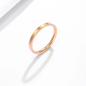 Detailed view of a sleek rose gold stainless steel ring with a polished finish and minimalist design
