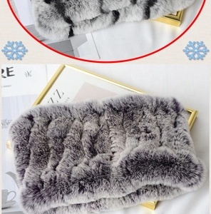Close-up detail of soft grey rabbit fur texture and thick knitted winter neck warmer scarf