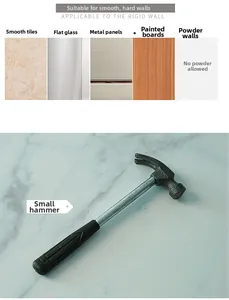 Close-up of a small household hammer with steel handle and non-slip grip on marble surface
