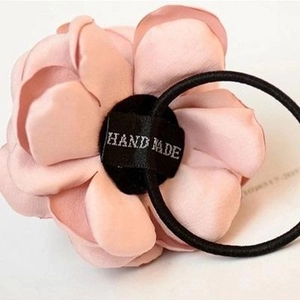 Handmade pink fabric rose flower hair tie with durable black elastic band