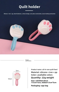 Close-up of pink and blue cat paw quilt clips with size specs and material details
