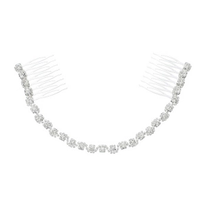 Close-up of silver bridal hair comb with shimmering rhinestones and elegant curved design