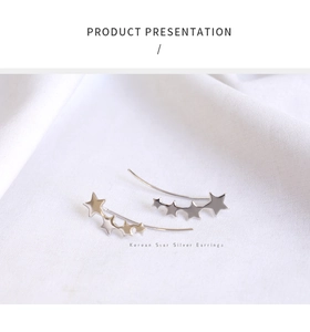 Macro shot of three descending S925 sterling silver star-shaped ear climbers for women