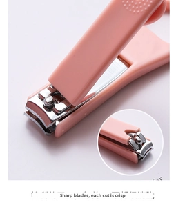 Detail view of pink nail clipper featuring sharp steel blades and non-slip texture grip