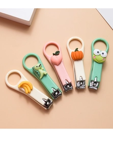 Set of five cute cartoon nail clippers featuring colorful dinosaur and fruit designs