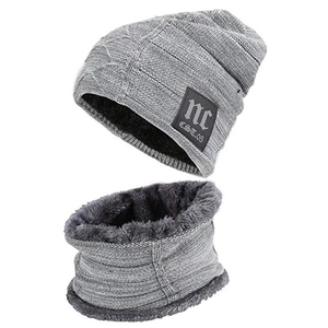 Detailed close-up of gray knit beanie and neck warmer set with soft faux fur lining