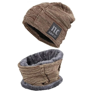 Detailed view of the brown knit beanie with plush grey fleece lining and NC leather patch