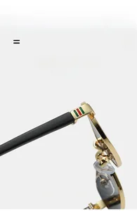 Detailed macro view of black sunglasses hinges with iconic green and red stripe design