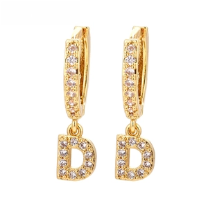 Close-up of gold-plated hoop earrings with micro-pave zircon letter D charms