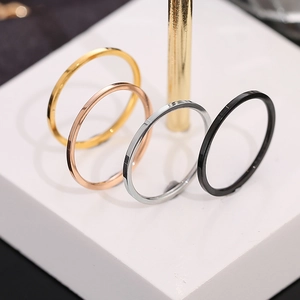 Minimalist stainless steel rings set in gold, rose gold, silver, and black polished finish