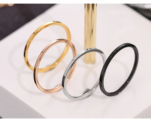 Detailed view of 18k gold, rose gold, silver and black minimalist stainless steel rings