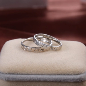 Romantic silver-plated couple rings with Love engraving and heart-shaped crystals