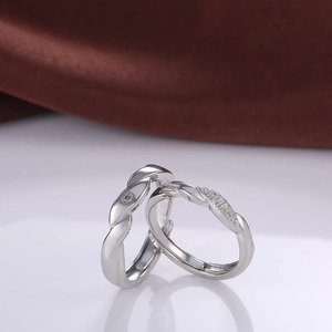 Silver couples ring set with mobius twist design and sparkling crystals in gift setting