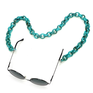 Peacock blue acrylic chunky link eyeglass chain strap on a minimalist white background