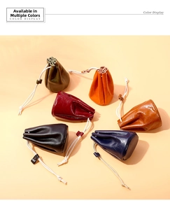 Top view of six colorful oil wax leather drawstring coin purses in various classic shades