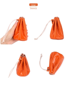 Detail view of orange leather drawstring coin purse with secure metal buckle closure