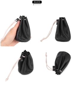 Black leather drawstring coin pouch macro detail showing soft texture and compact size