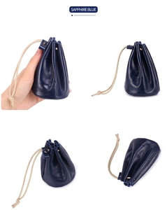 Detail view of sapphire blue oil wax leather coin purse showing the drawstring closure