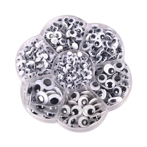 Petal-shaped organizer box containing assorted sizes of black and white googly eyes