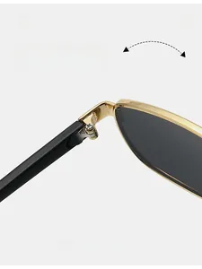 Detail of durable golden metal hinges on sleek black retro square sunglasses