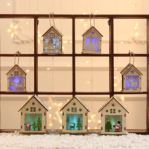 Lighted Christmas wooden house ornaments featuring Santa, reindeer and snowman designs