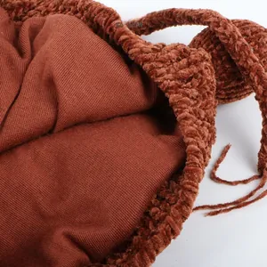 Detail of warm winter baby hat showing soft brown chenille fabric and knitted lining