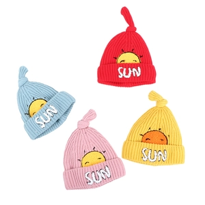 Cozy winter knit baby hats in four colors with cute sun embroidery and top knots