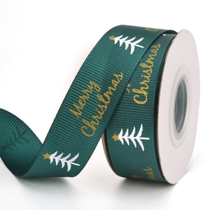 Green Christmas grosgrain ribbon roll with gold Merry Christmas print and white trees