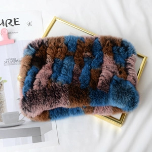 Detailed texture of multi-color woven rabbit fur neck warmer with thick plush material