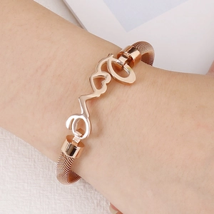Rose gold mesh love bracelet with heart design on wrist, elegant gift for her