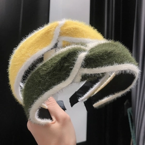 Close-up of plush knotted headband featuring soft faux mink fur and crisscross design